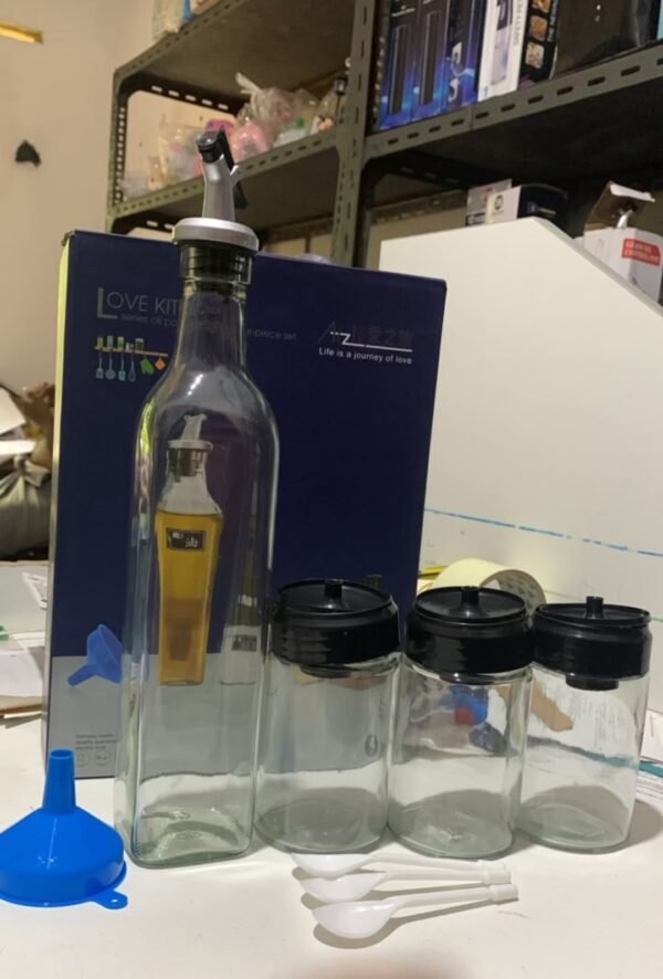 Oil Bottle With Three Spice Bottles And Funnel